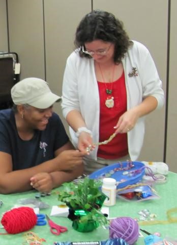 A participant learns jewelry making as a healthy way to relax and socialize in the evenings