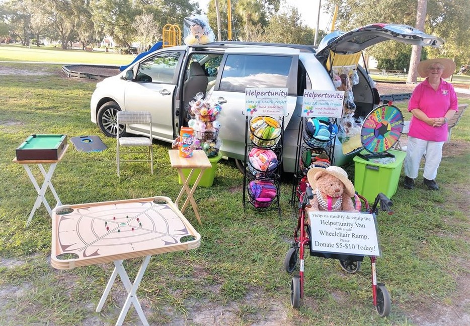 The Helpertunity Handcrafters and Games Booth shown in the Park raising funds at the Apopka Fair to Convert the Chairity's Newly Financed Van to become Wheelchair Accessible. 